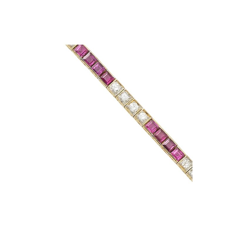 An 18ct yellow gold ruby and diamond line bracelet