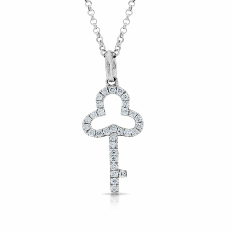 An 18ct white gold diamond set key pendant on a chain