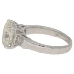 Oval-cut diamond solitaire ring with baguette diamond shoulders