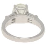 Oval-cut diamond solitaire ring with baguette diamond shoulders