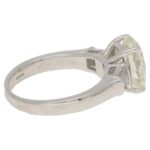 Oval-cut diamond solitaire ring with baguette diamond shoulders