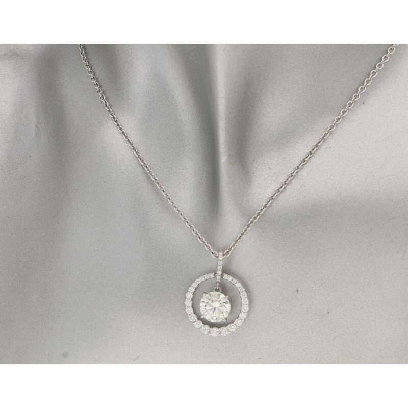 Circular diamond pendant with diamond drop in white gold