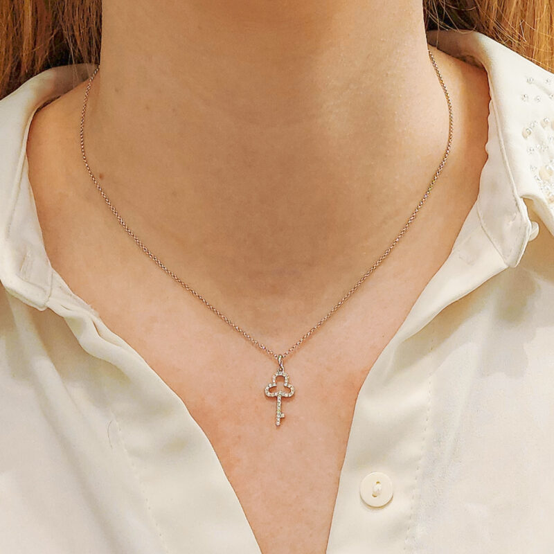 An 18ct white gold diamond set key pendant on a chain at Susannah Lovis Jewellers