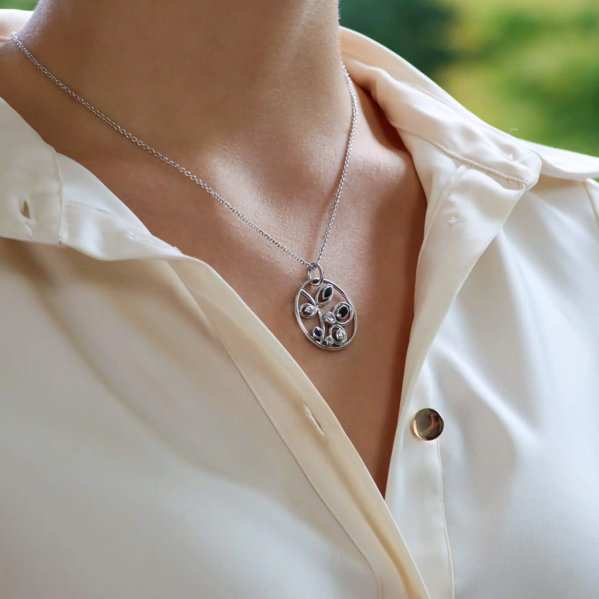 Modern Sapphire and Diamond Circular Foliate Pendant White Gold
