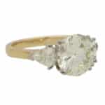 Contemporary Round Brilliant Cut Diamond and Shield Cut Ring