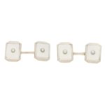 A set of mother-of-pearl cufflinks and dress studs