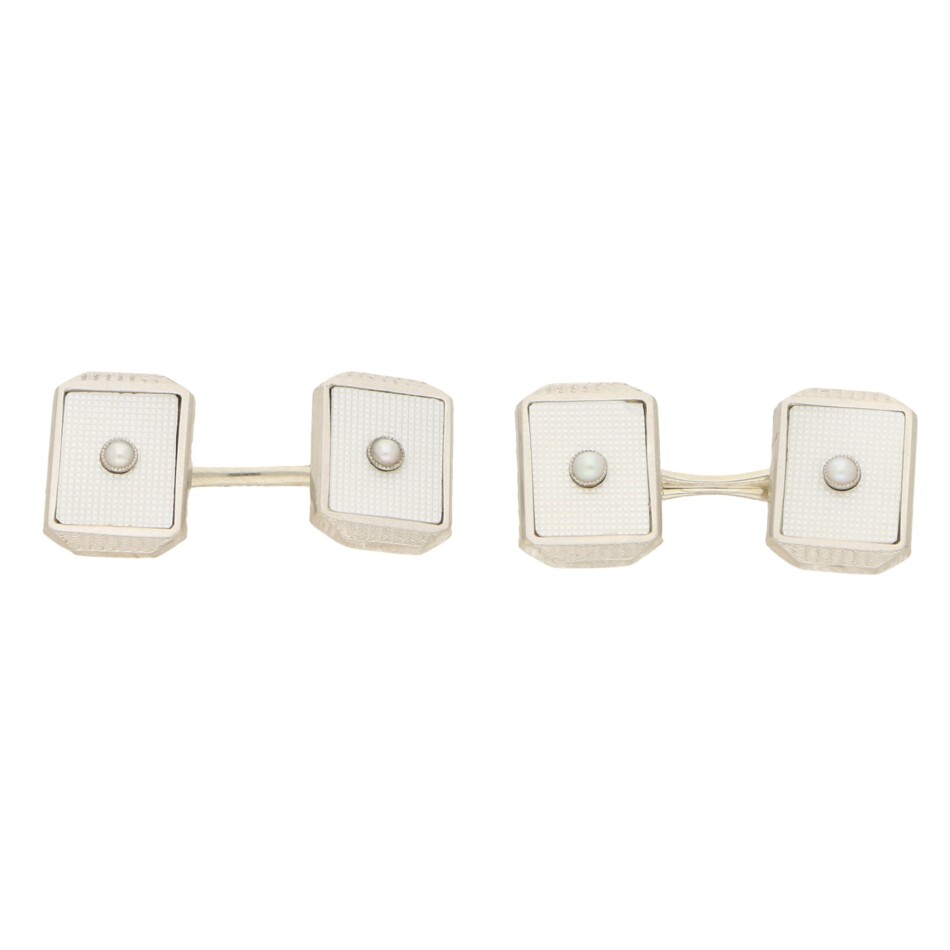 A set of mother-of-pearl cufflinks and dress studs