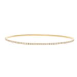 Diamond bangle in 18K yellow gold.