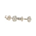 Floral diamond stud earrings in 18k white gold.