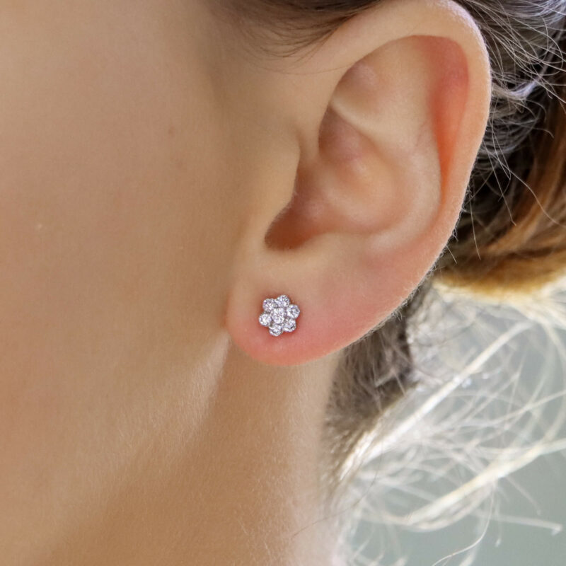 Floral diamond stud earrings in 18k white gold.