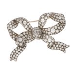 Victorian diamond bow brooch in silver and yellow gold.