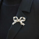 Victorian diamond bow brooch in silver and yellow gold.