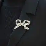 Victorian diamond bow brooch in silver and yellow gold.