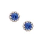 Sapphire and diamond cluster stud earrings in 18k white gold.