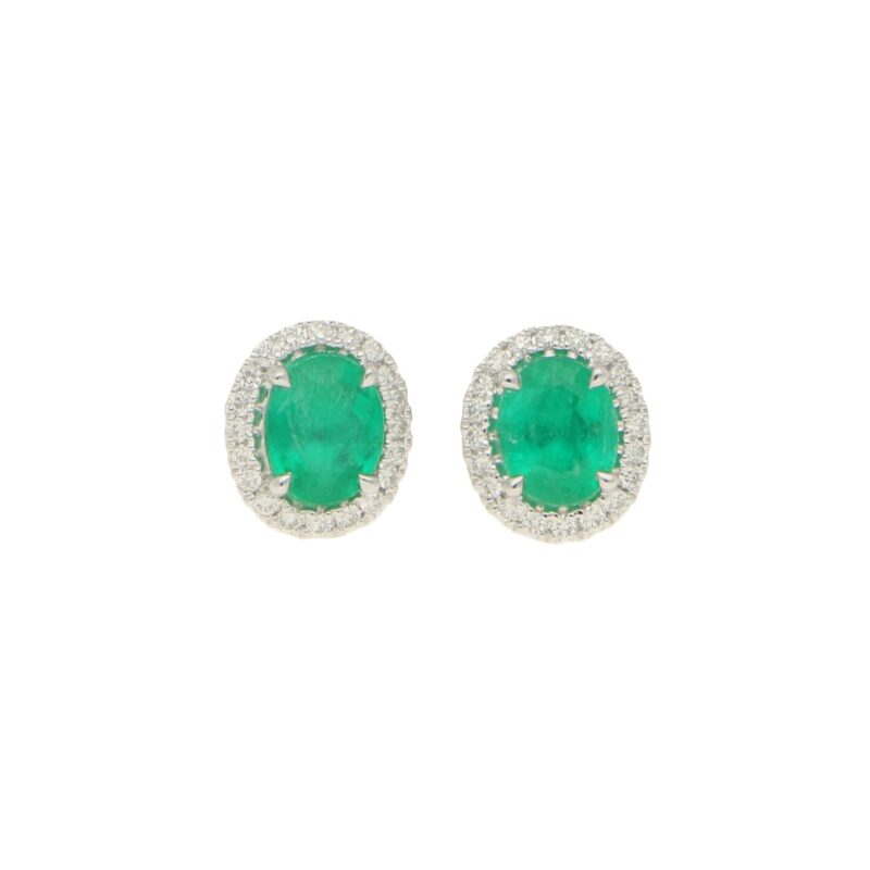 Emerald and diamond cluster earrings in 18K white gold.