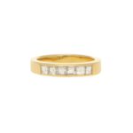 Half diamond eternity ring in 18k yellow gold.