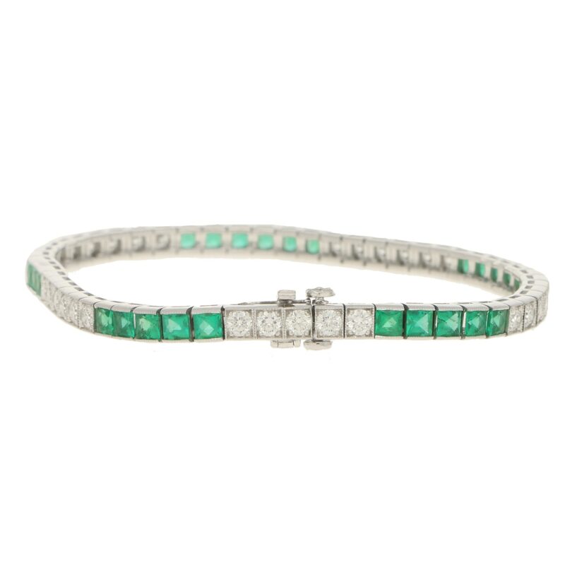 Platinum diamond and emerald line bracelet