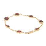 Red Garnet Spectacle Bracelet in 9k Yellow Gold