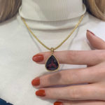 Pear-Shaped Red Garnet Pendant Set in 9k Yellow Gold