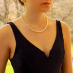 White Pearl Strand Necklace With Brushed Gold Clasp