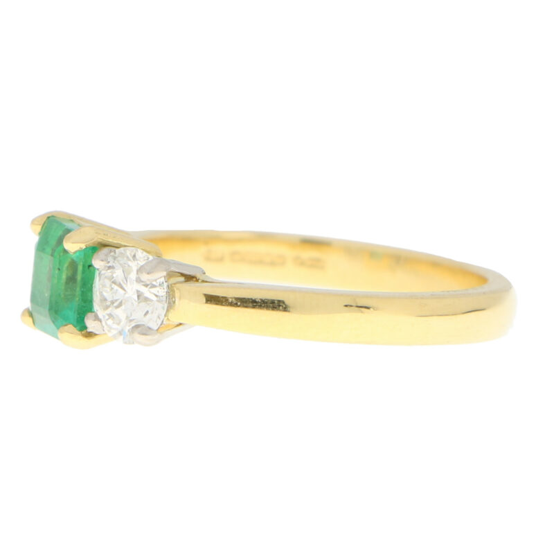 Emerald and Diamond Trilogy Engagement Ring in Yellow Gold