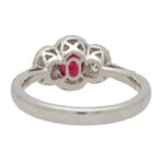 Ruby and Diamond Haloed Three Stone Ring