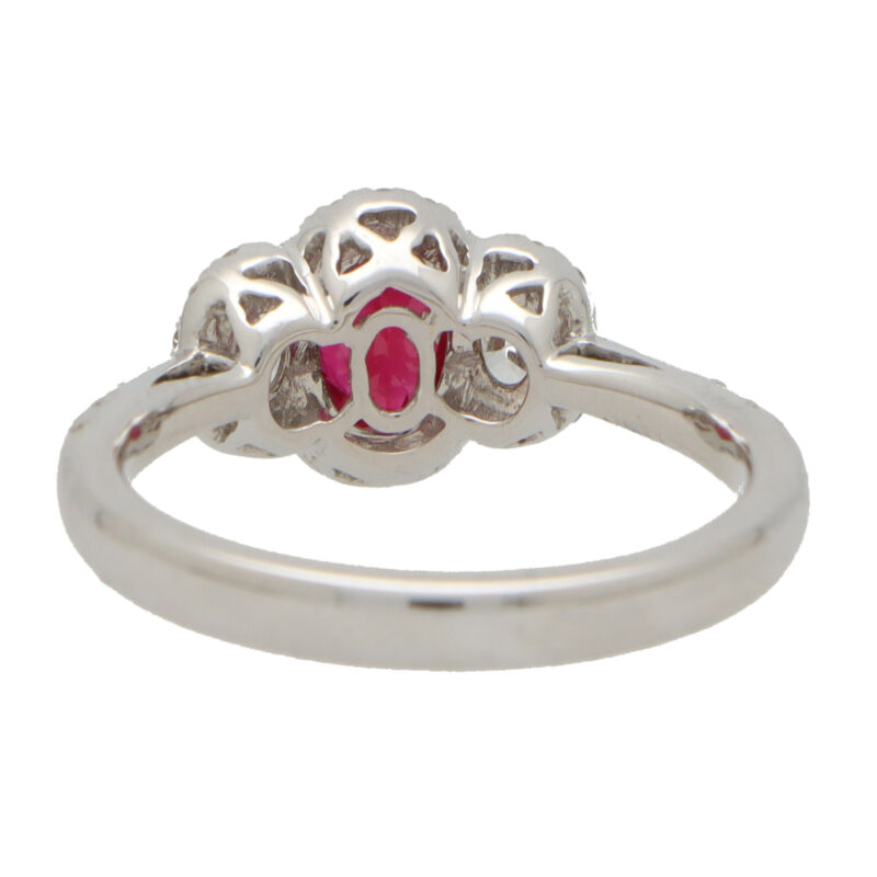 Ruby and Diamond Haloed Three Stone Ring