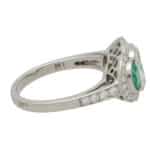 Art Deco Inspired Oval Diamond and Emerald Haloed Three Stone