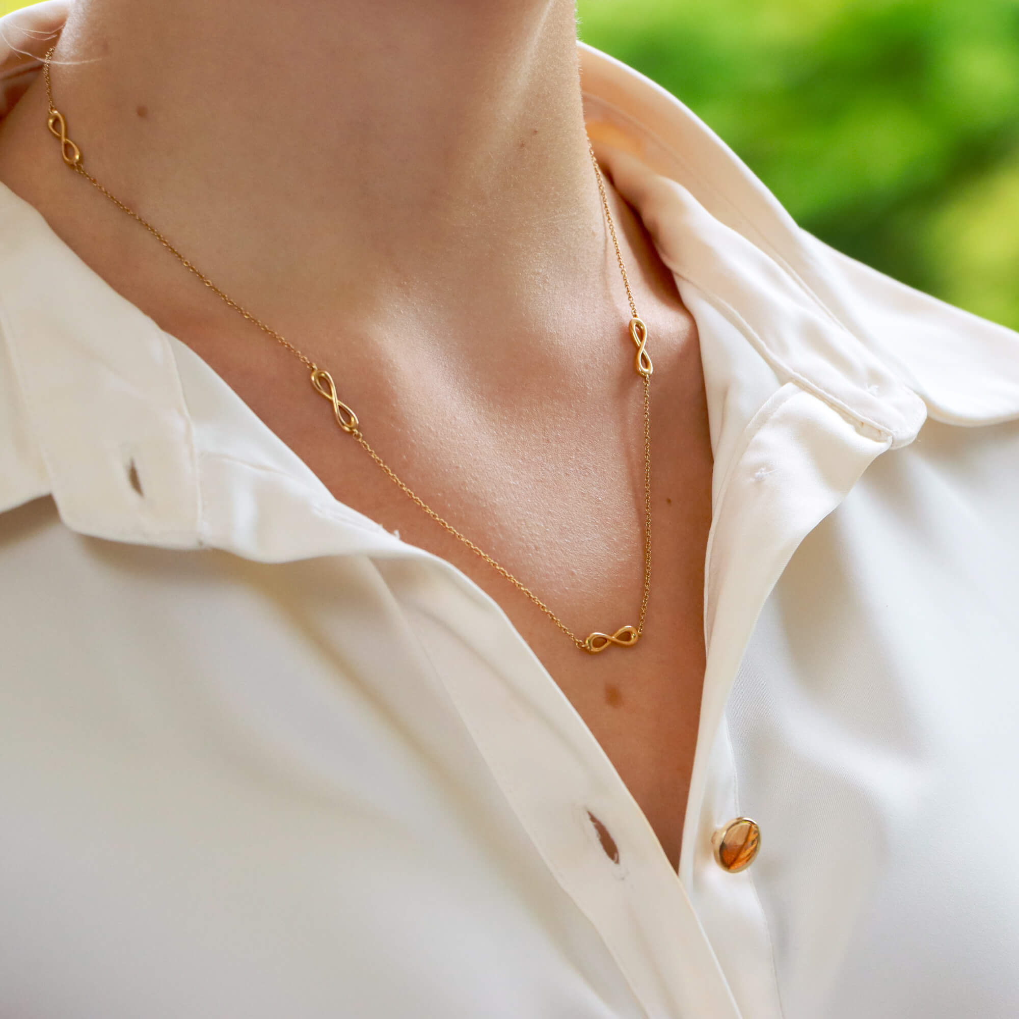 Sideways infinity necklace top