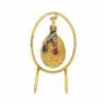 A rare Fabergé gold egg pendant with diamonds and sapphires.