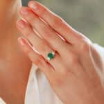 Contemporary Cushion Cut Emerald and Diamond Three Stone Ring