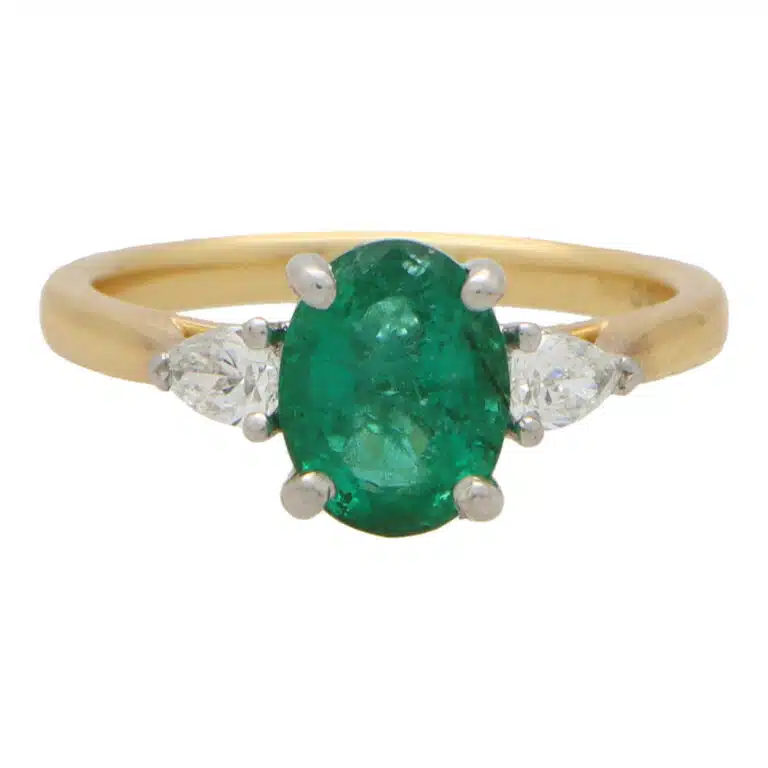 Contemporary Emerald and Pear Cut Diamond Three Stone Ring