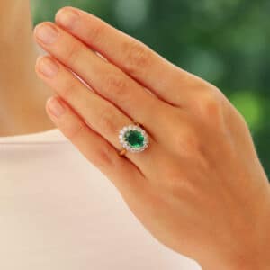 Contemporary Oval Emerald and Diamond Cluster Ring