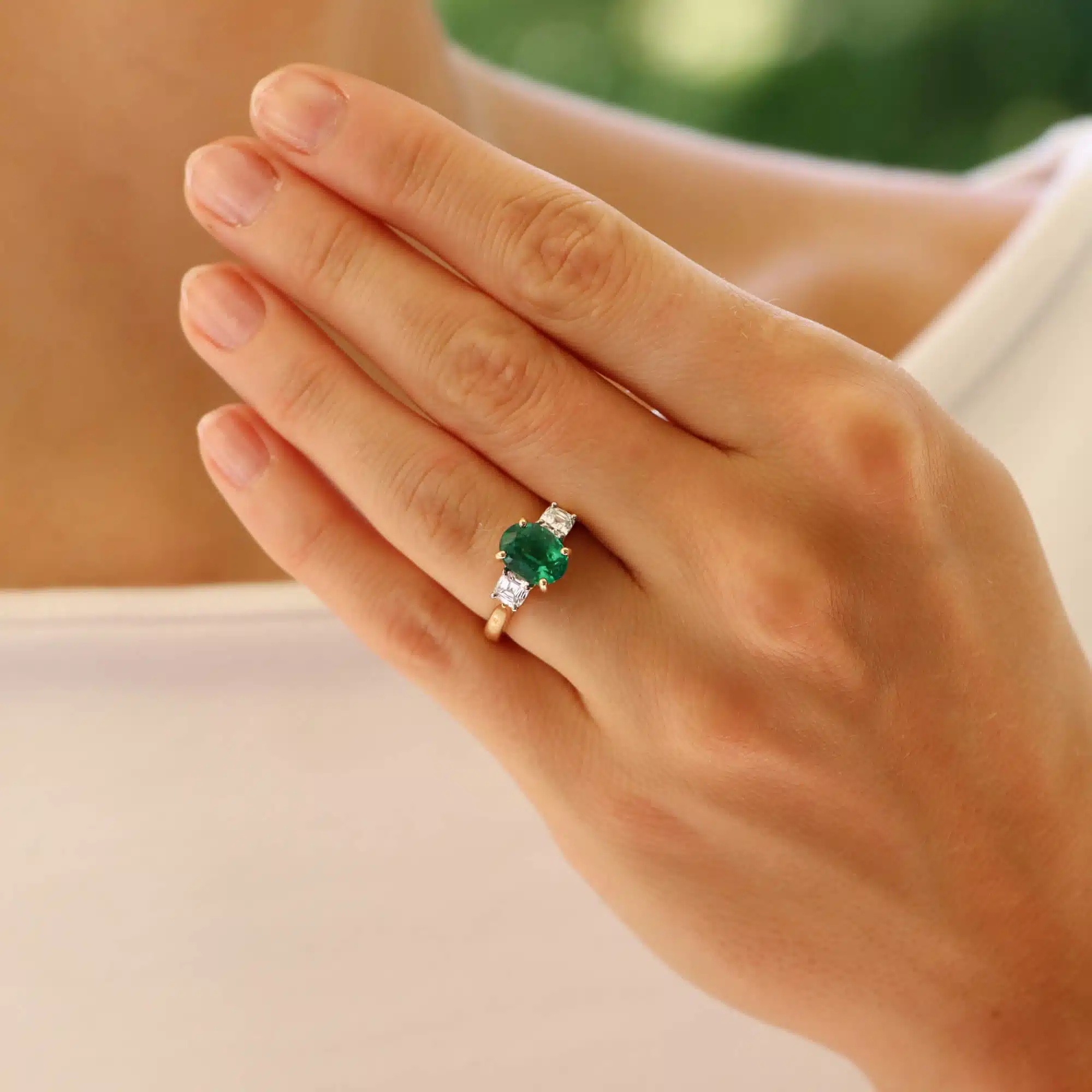 Contemporary Oval Emerald and Cushion Cut Diamond Ring