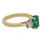 Contemporary Oval Emerald and Cushion Cut Diamond Ring
