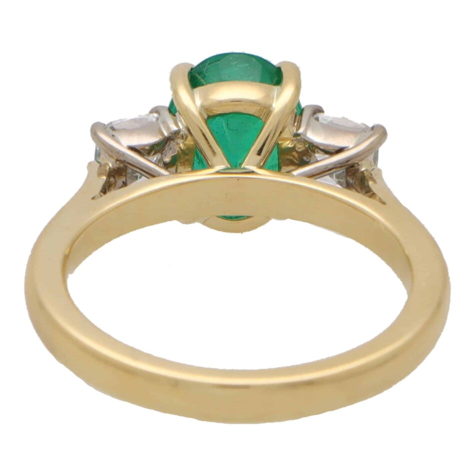 Contemporary Oval Emerald and Cushion Cut Diamond Ring