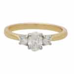 Contemporary GIA Certified Oval Diamond Three Stone Ring