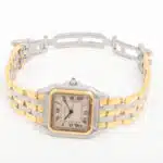 A vintage Cartier Panthere three-row gold and steel watch