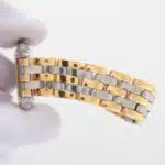 A vintage Cartier Panthere three-row gold and steel watch