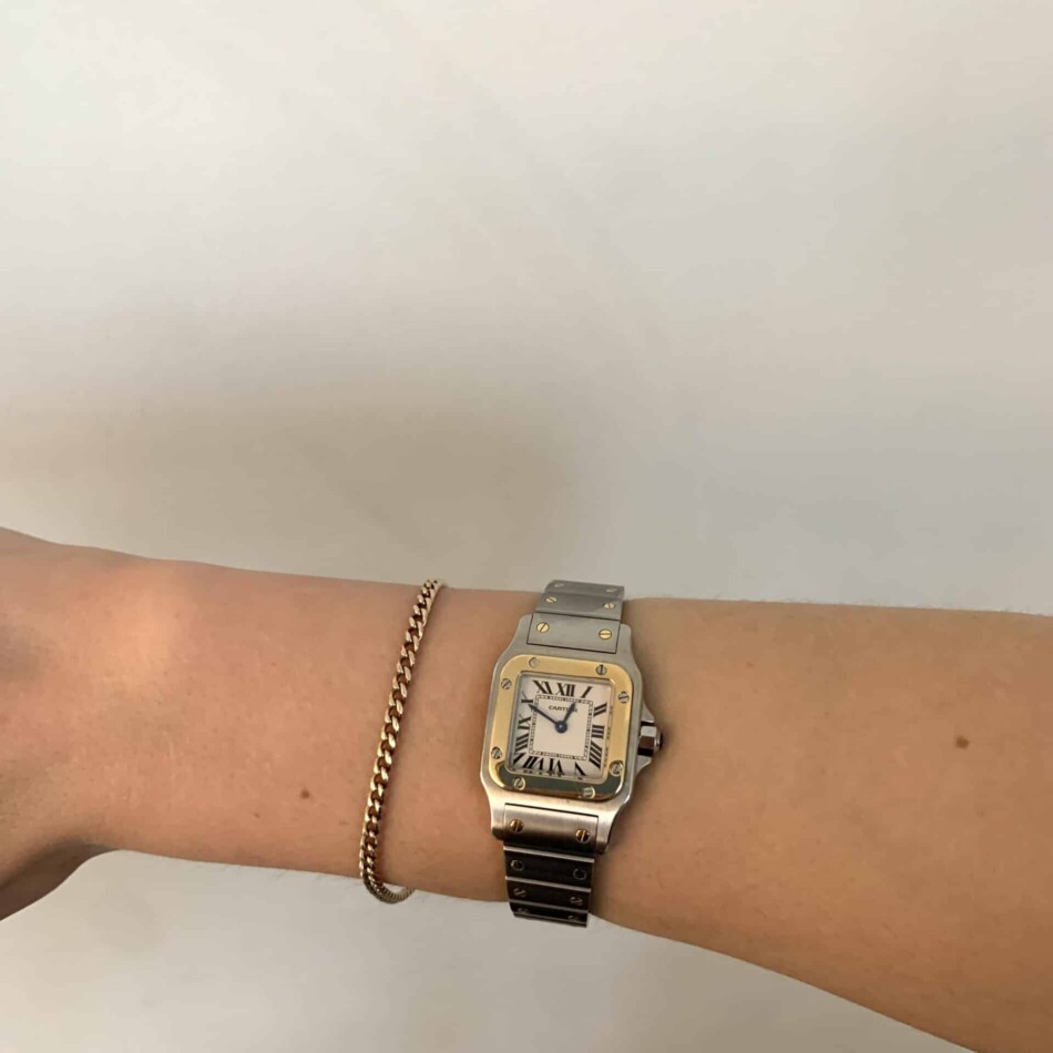 Cartier Santos steel and gold wrist watch with quartz movement.