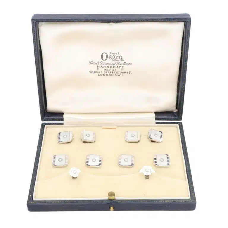 A set of Mother-of-Pearl and Diamond Cufflinks and Dress Studs