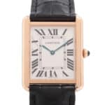 Cartier Tank Solo wrist watch in 18k yellow gold and steel.