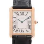 Cartier Tank Solo wrist watch in 18k yellow gold and steel.